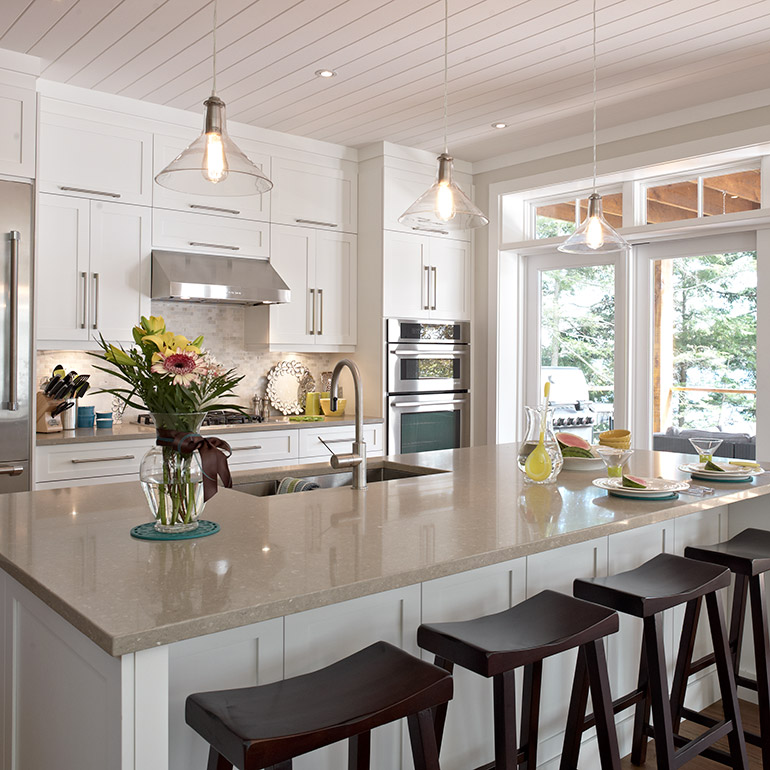 Cuisines Beauregard |Storage space in bench section of a contemporary style island in solid wood